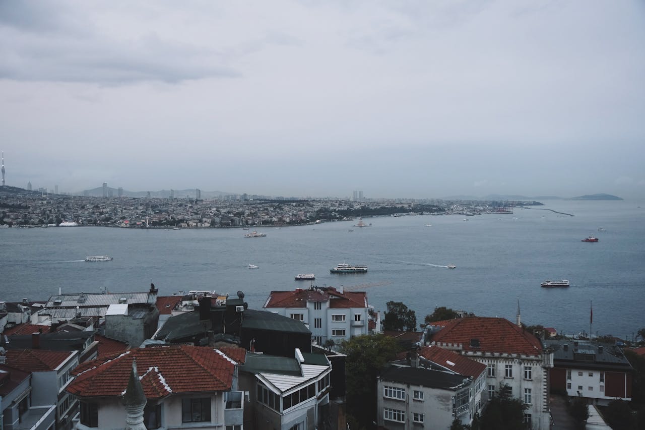 Captivating view of the Bosphorus Strait from Istanbul rooftops with boats and cityscape.