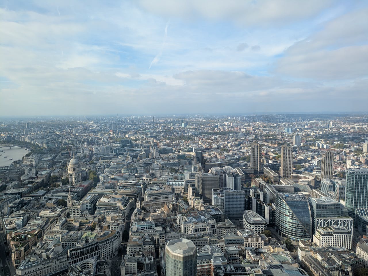 Breathtaking aerial view of the sprawling cityscape of London on a clear day.